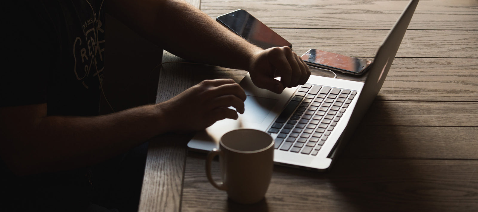 a person typing on a laptop