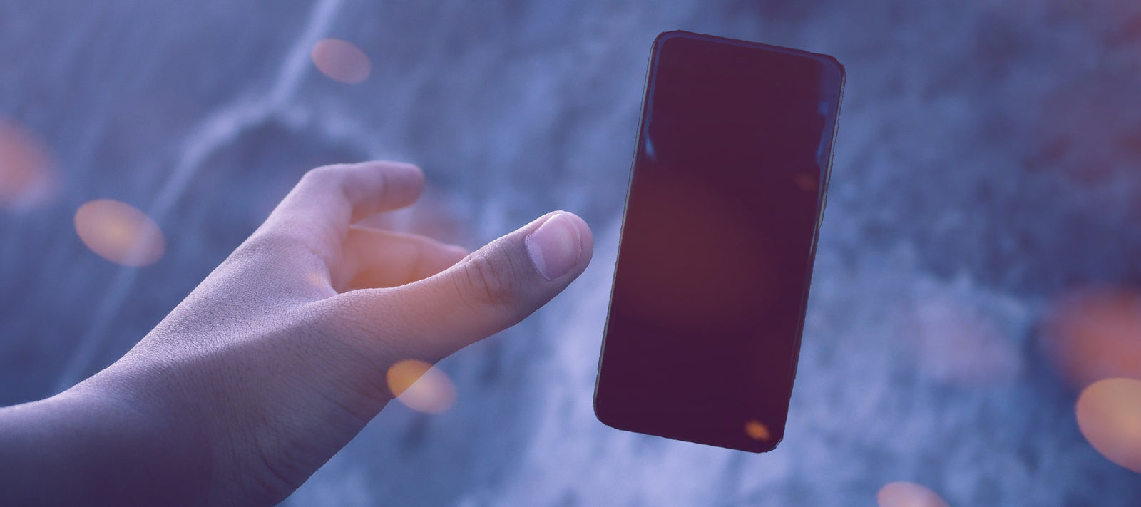 a person reaching for a phone